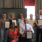 Cleaning and Catering colleagues being presented their leadership course award