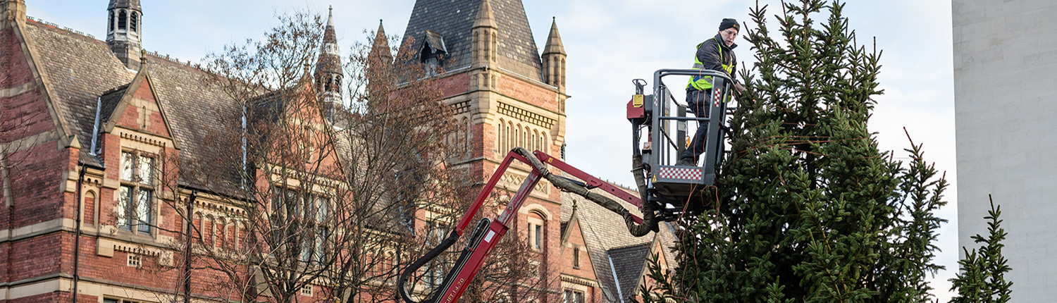 Grounds & Gardens in cherry picker outside Great Hall