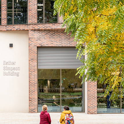 Esther Simpson exterior with two students outside