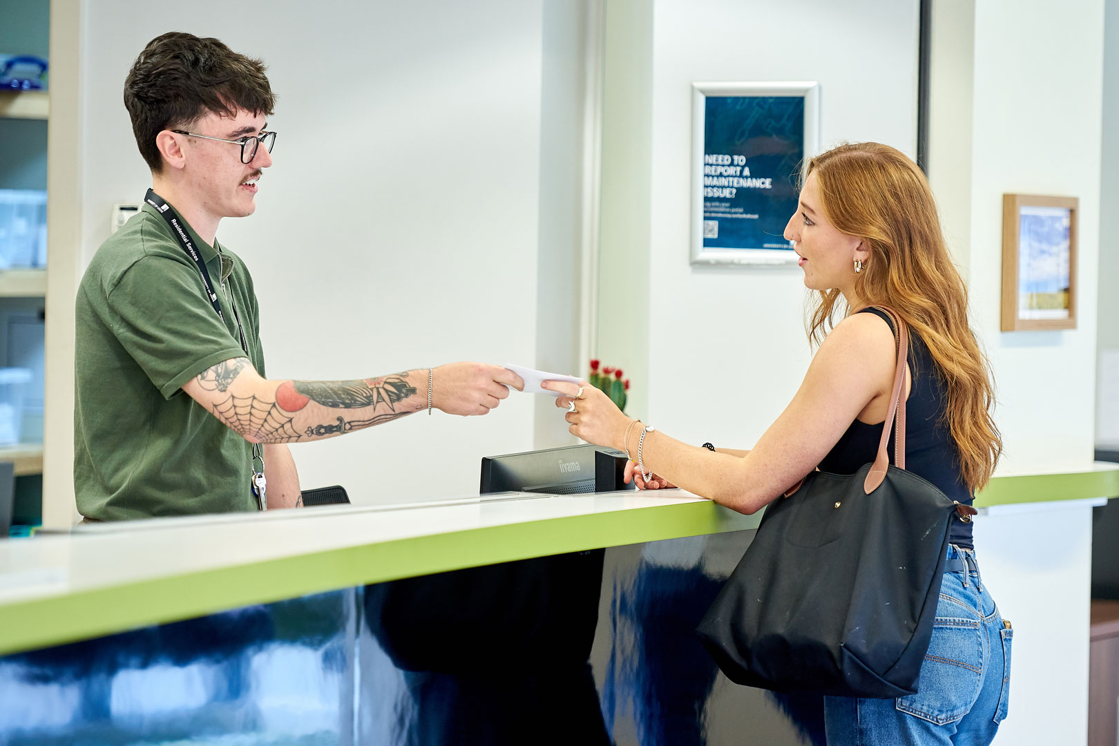 Reception team helping student